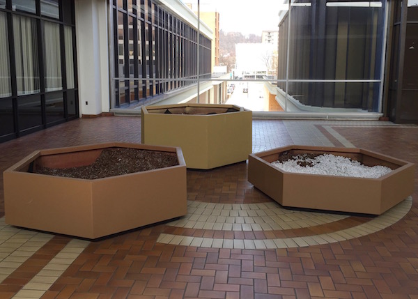 Large hexagon-shaped planters filled with both dirt and styrofoam packing peanuts, Allegheny Center Mall, Pittsburgh, PA