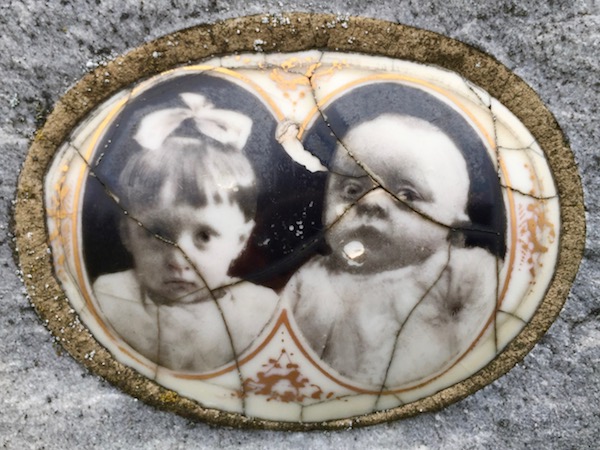 detail of marble headstone with embedded ceramic photograph of a young girl and baby, Loretto Cemetery, Pittsburgh, PA