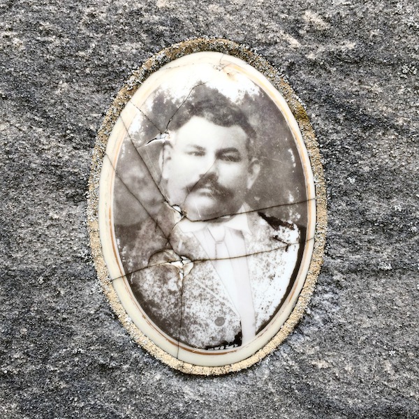 detail of marble headstone with embedded ceramic photograph of older man, Loretto Cemetery, Pittsburgh, PA