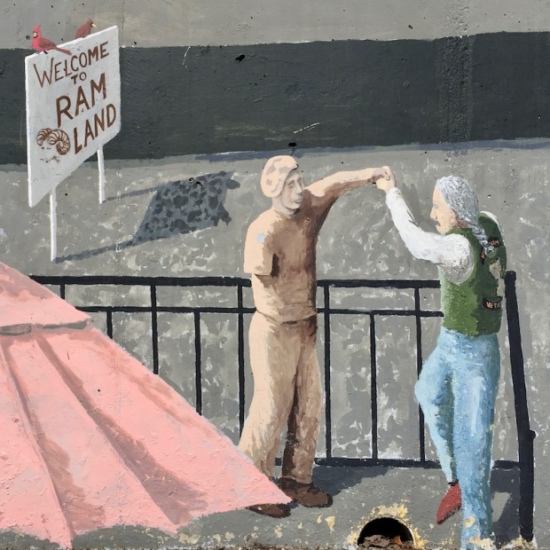 mural detail of Vietnam War veterans dancing and "Welcome to RAM LAND" sign, Tarentum, PA