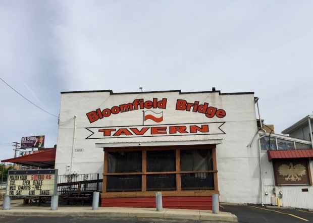 exterior of Bloomfield Bridge Tavern with Polish red and white flag and logo, Pittsburgh, PA