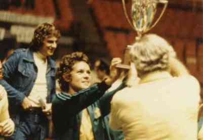 tennis star Evonne Goolagong-Cawley holding a trophy for the World Team Tennis Cup, 1975
