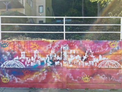mural of downtown Pittsburgh skyline by artist Baron Batch
