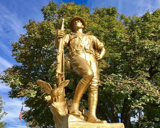 World War I memorial featuring doughboy statue painted gold in Townsend Park, New Brighton, PA