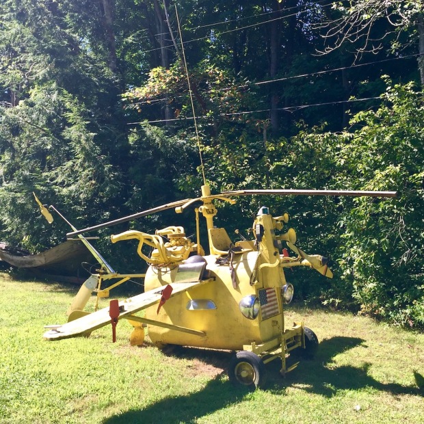 outdoor sculpture of fantasy flying machine created with recycled parts