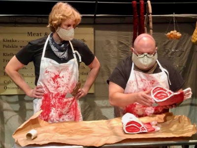 puppeteers Will Schultze and Dave English costumed as butchers