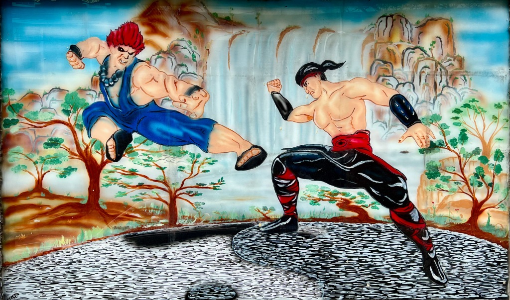hand-painted window at martial arts academy show figures in combat