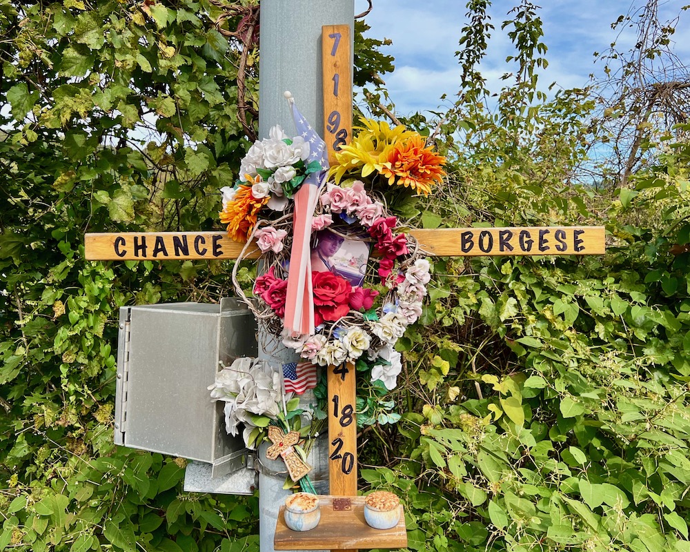 roadside memorial cross attached to utility pole