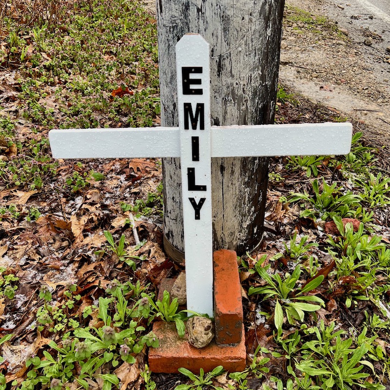 memorial cross left by utility pole