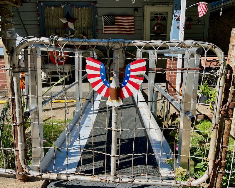 front gate with eagle ornament painted like American flag