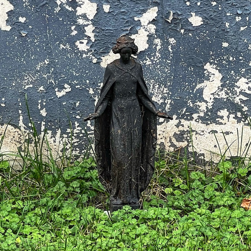 statue of St. Barbara in front yard of house
