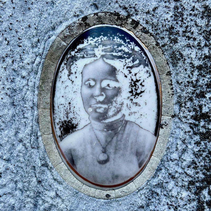 ceramic photo grave marker inset distorted as to appear in negative