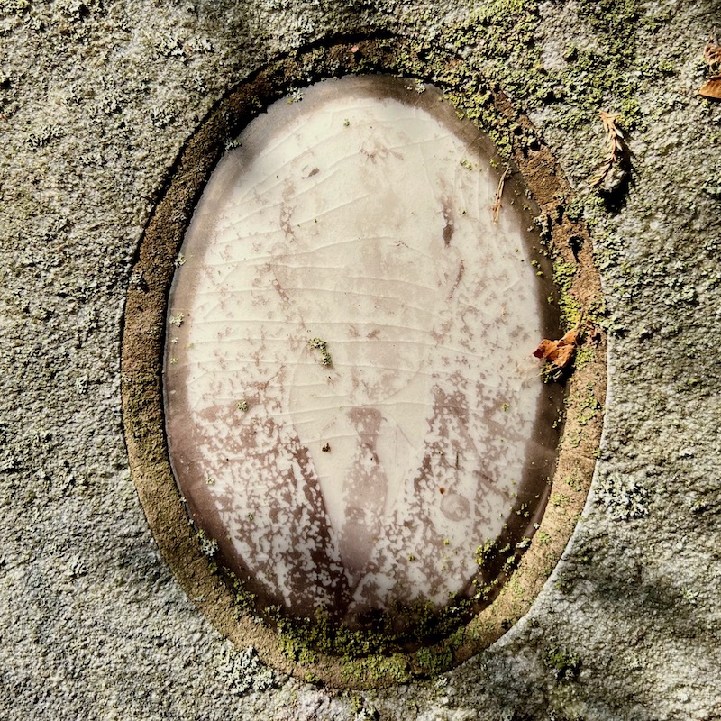 ceramic photo grave marker inset of photo so faded as to appear ghostly