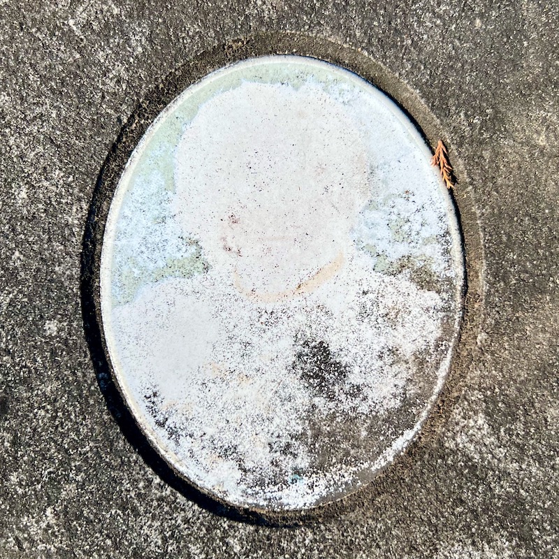 ceramic photo grave marker inset where photo is barely recognizable