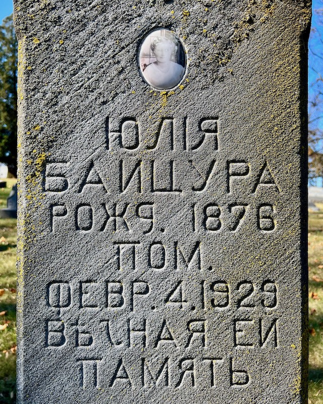 grave marker with inset ceramic portrait of the deceased