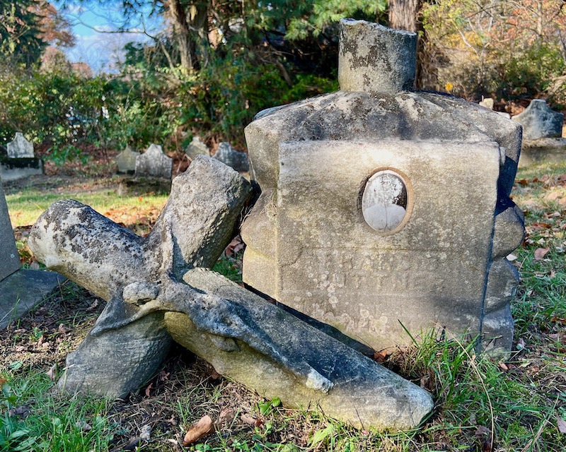 weathered grave marker with inset ceramic photo
