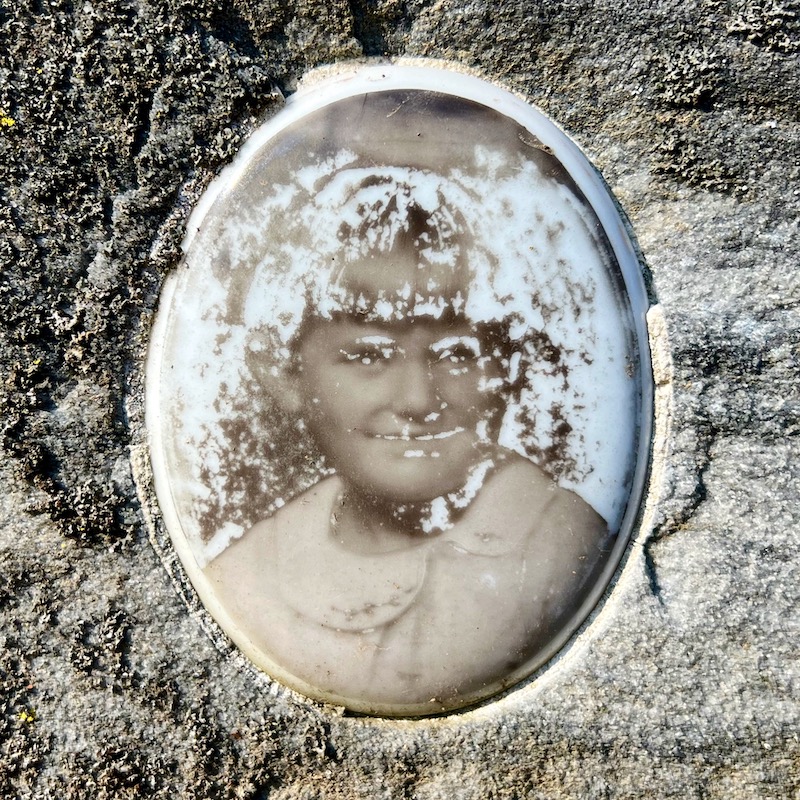 ceramic photo grave marker inset of young girl with photo disintegrating
