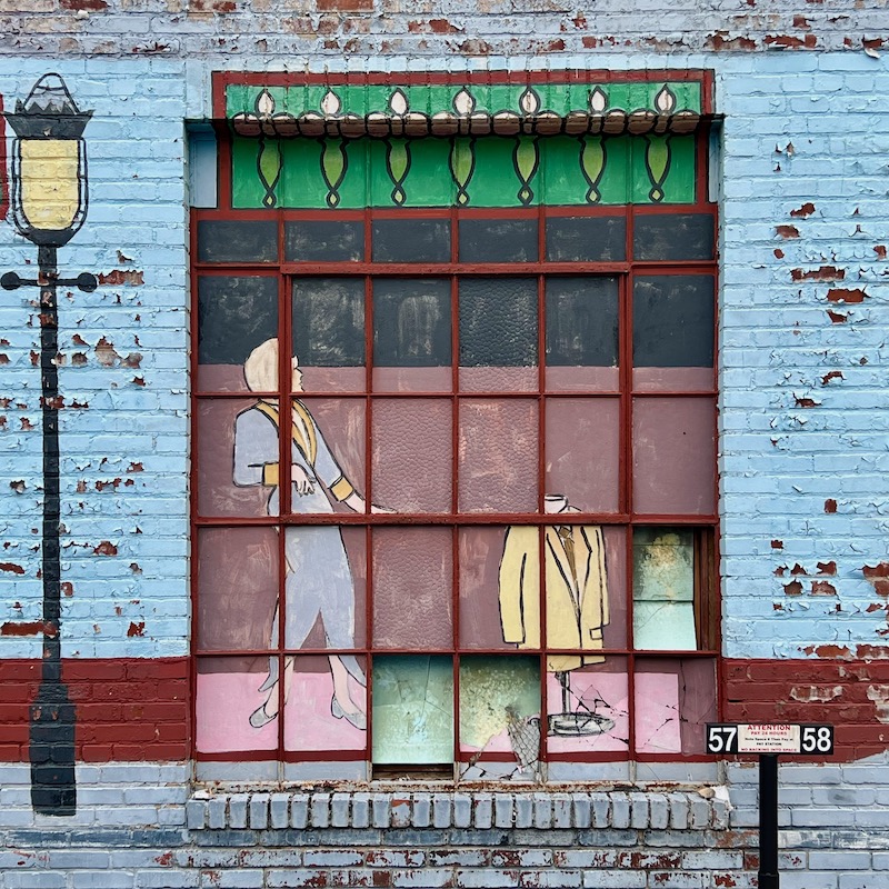 large former window painted over as part of large mural