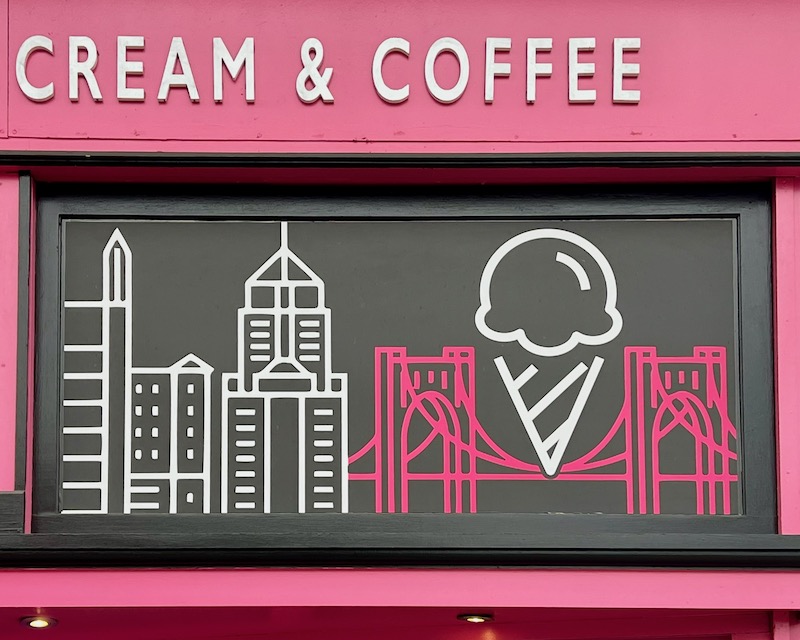business sign with downtown Pittsburgh and large ice cream cone