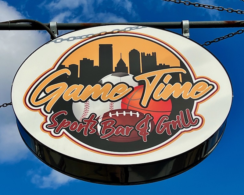 sign for sports bar featuring skyline of downtown Pittsburgh