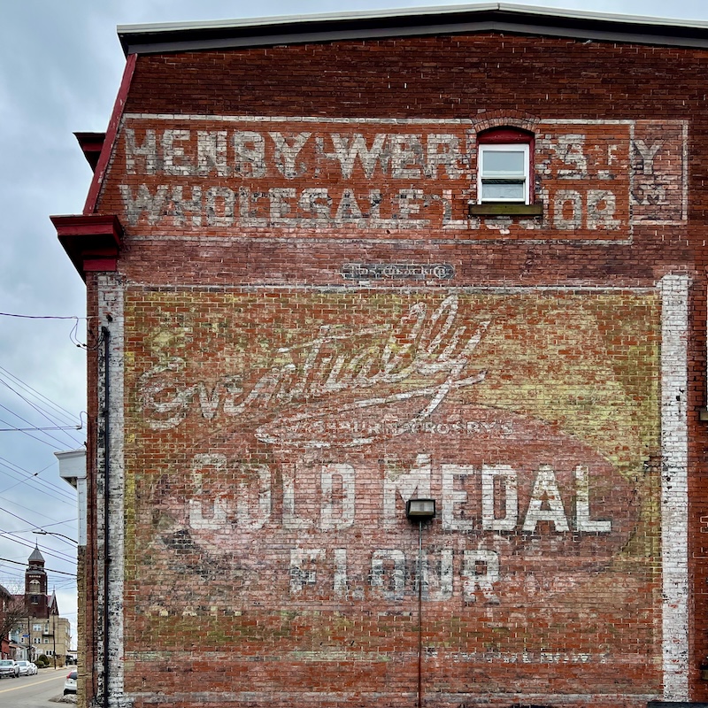 brick wall painted with faded advertisement for Gold Medal Flour