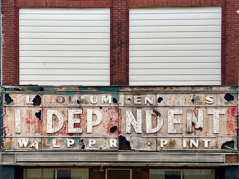 dilapidated sign for retail store