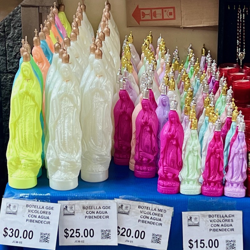 colorful Mary-shaped bottles of holy water for sale