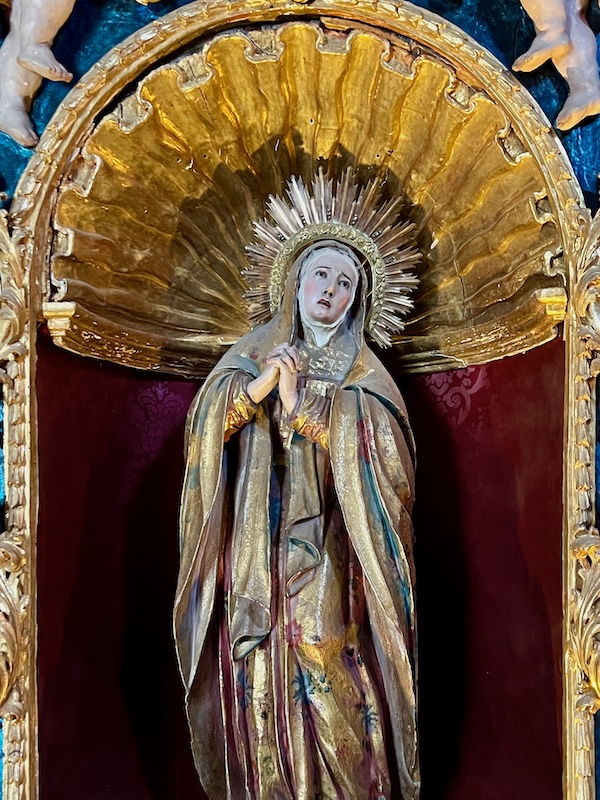 statue of Mary inside Catholic church